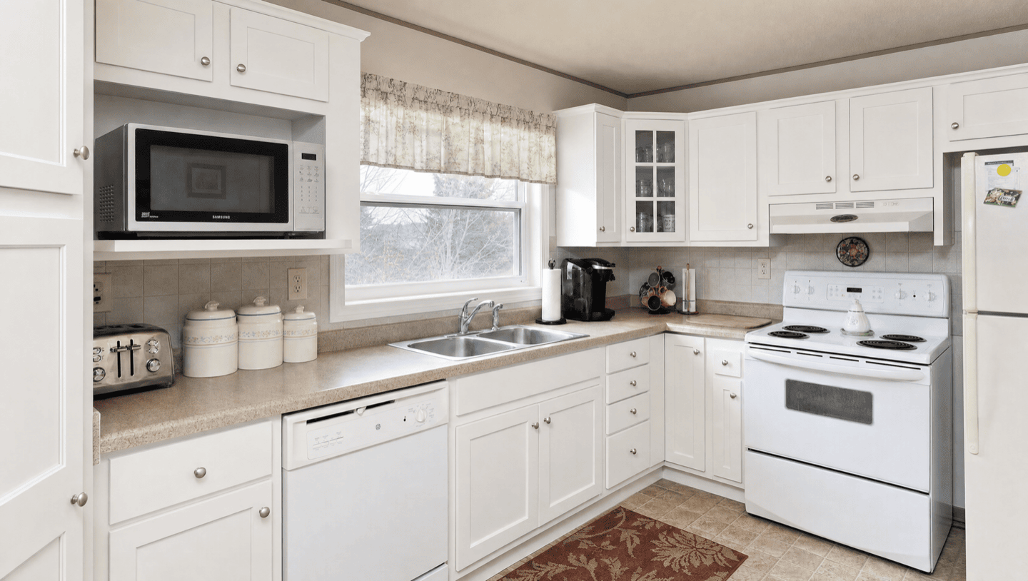 Same Sunnyvale kitchen after cabinets refinished soft white shaker