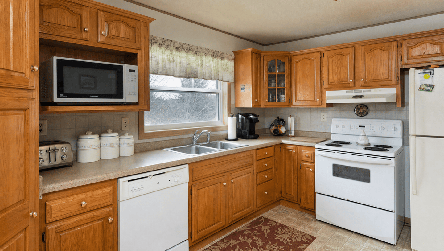 Honey oak kitchen cabinets before refinishing in Sunnyvale