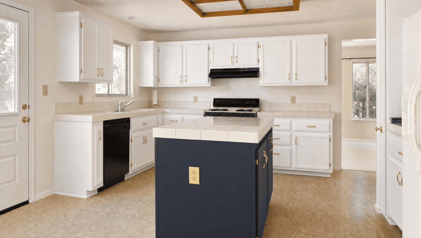 Same Palo Alto kitchen after refinishing two-tone white with navy island