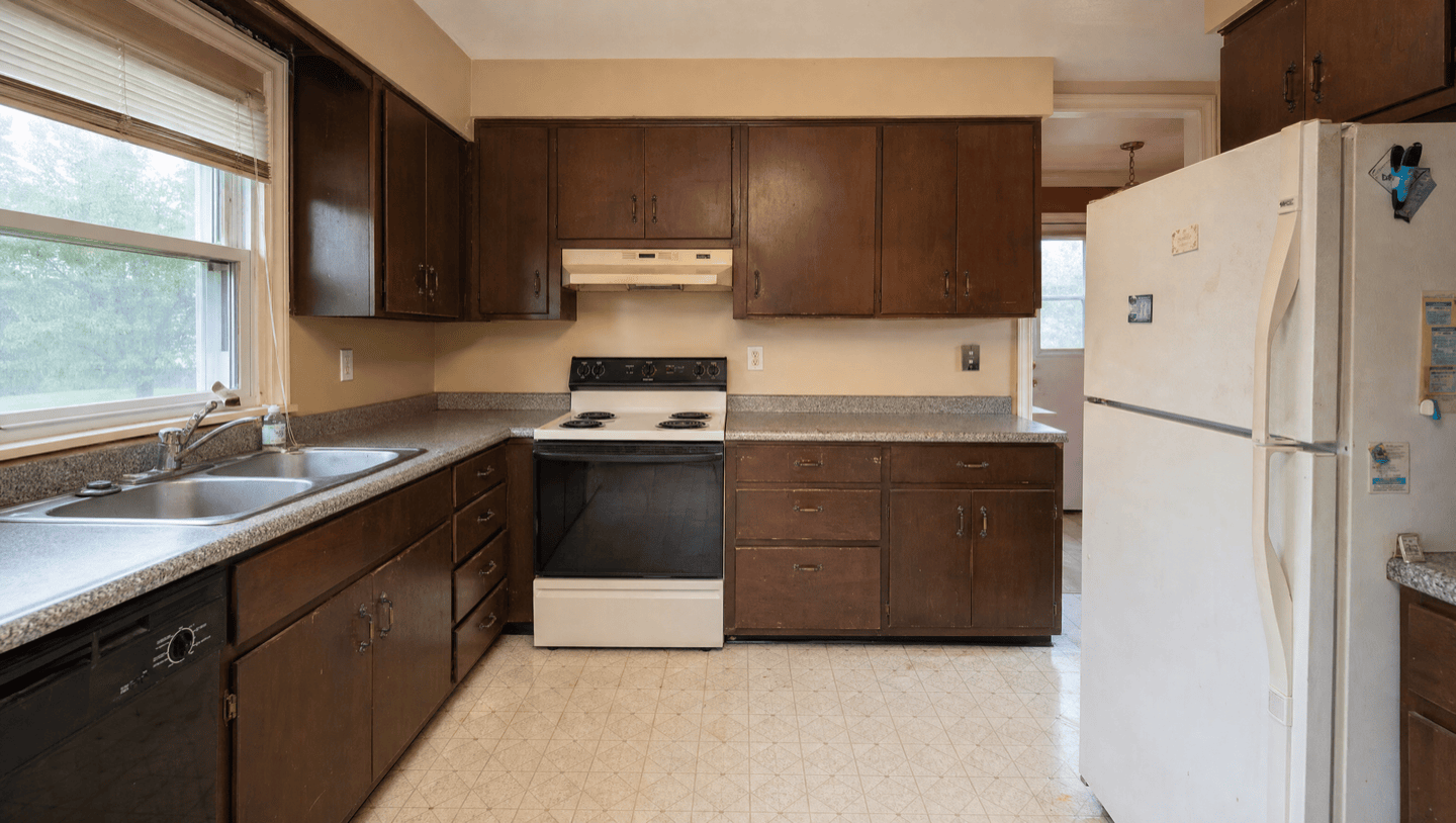 Dark brown veneer cabinets before refinishing in Oakland